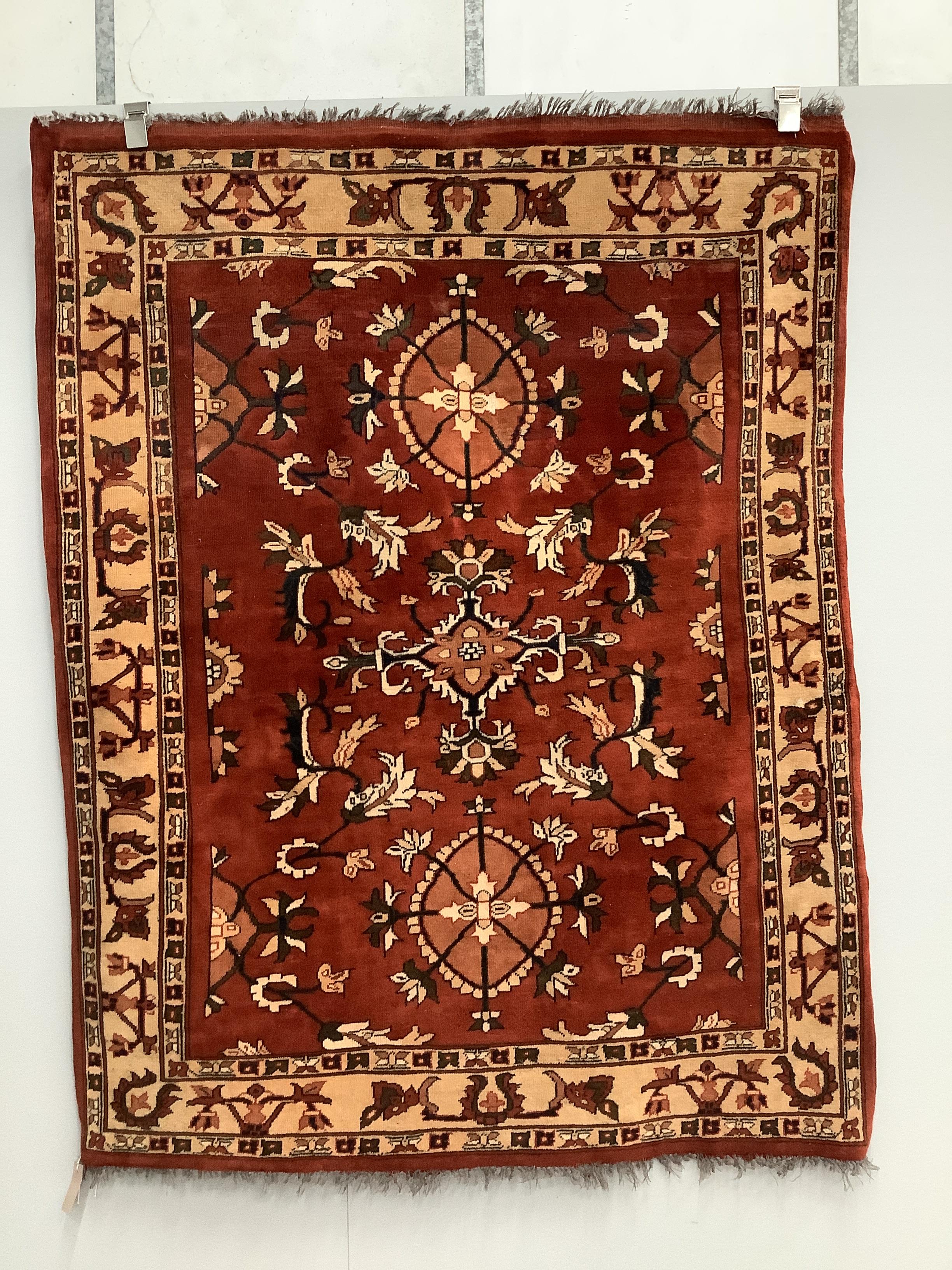 Two Turkish red ground rugs, larger 156 x 130cm